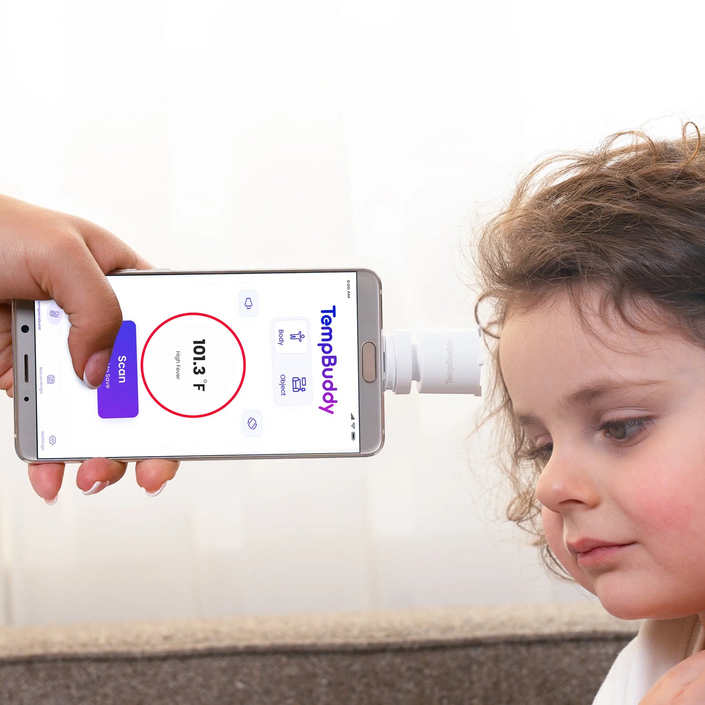 A child's temperature being checked with a TempBuddy smart thermometer with app tracking