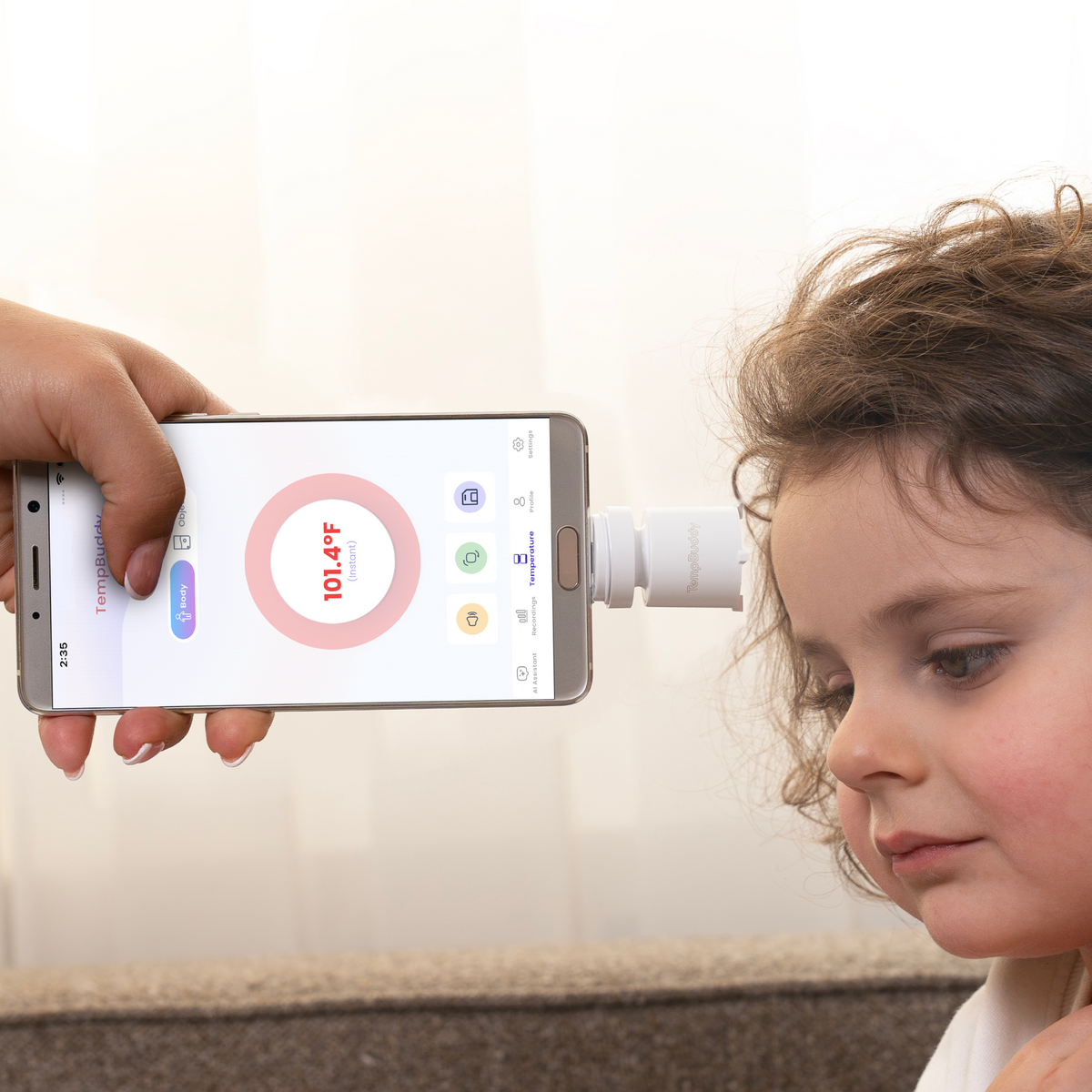 Scanning a child's forehead with TempBuddy