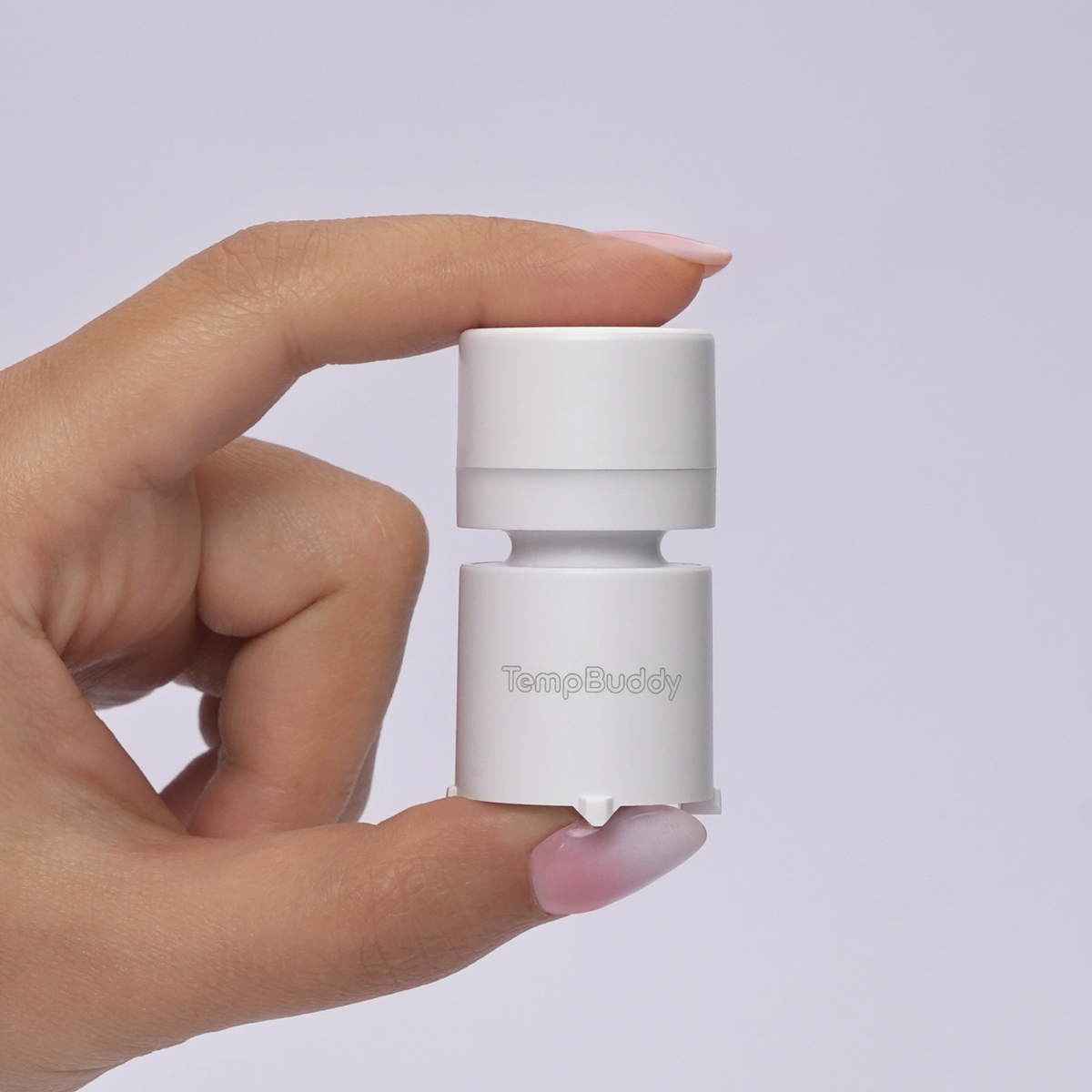 TempBuddy held between finger and thumb