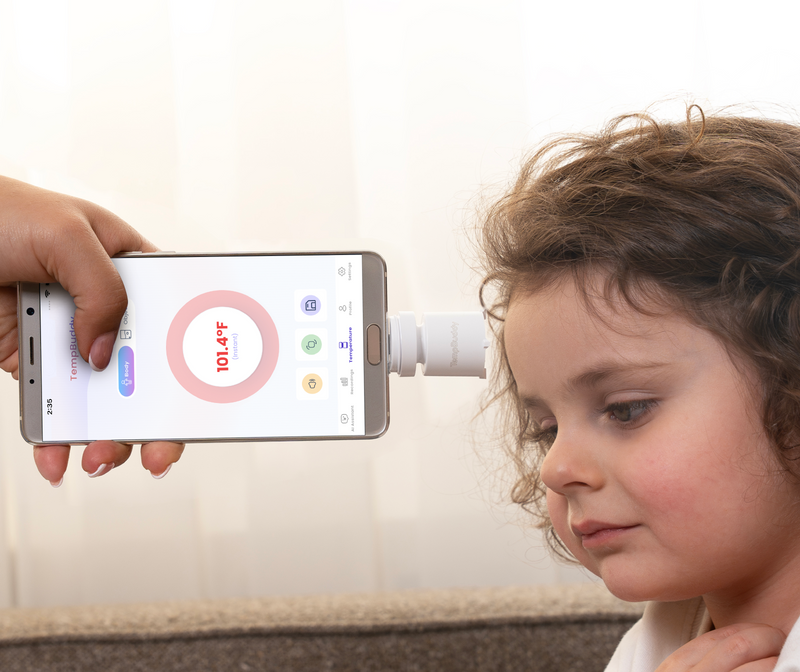 Scanning a child's forehead with TempBuddy
